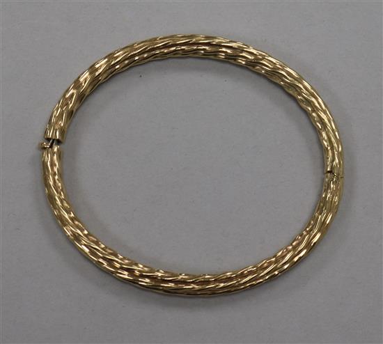 A 9ct gold ropetwist bangle.